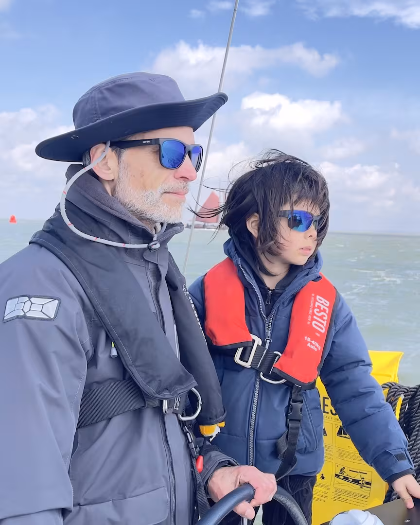 A child aboard during a quiet sailing moment
